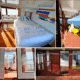 3 days shared trip. Cozy cabin interior with large windows, a bed, and a seating area, offering views of the water and a sunny deck.